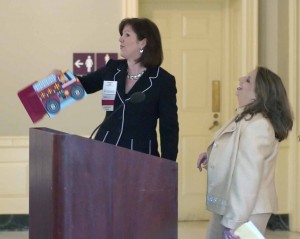 Showing the audience the next speaker's step-stool.